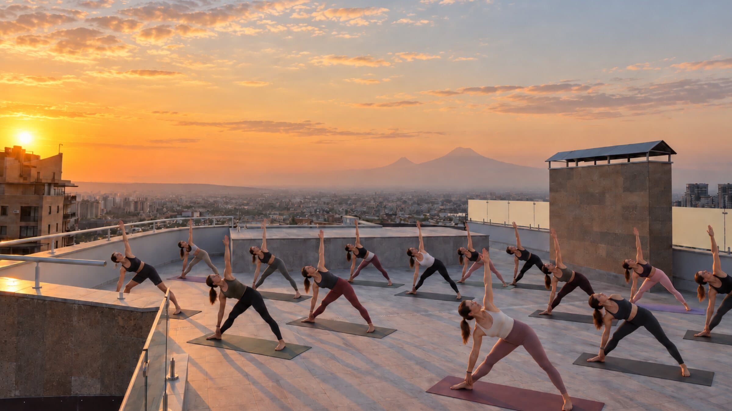 Yoga class on the rooftop at sunset