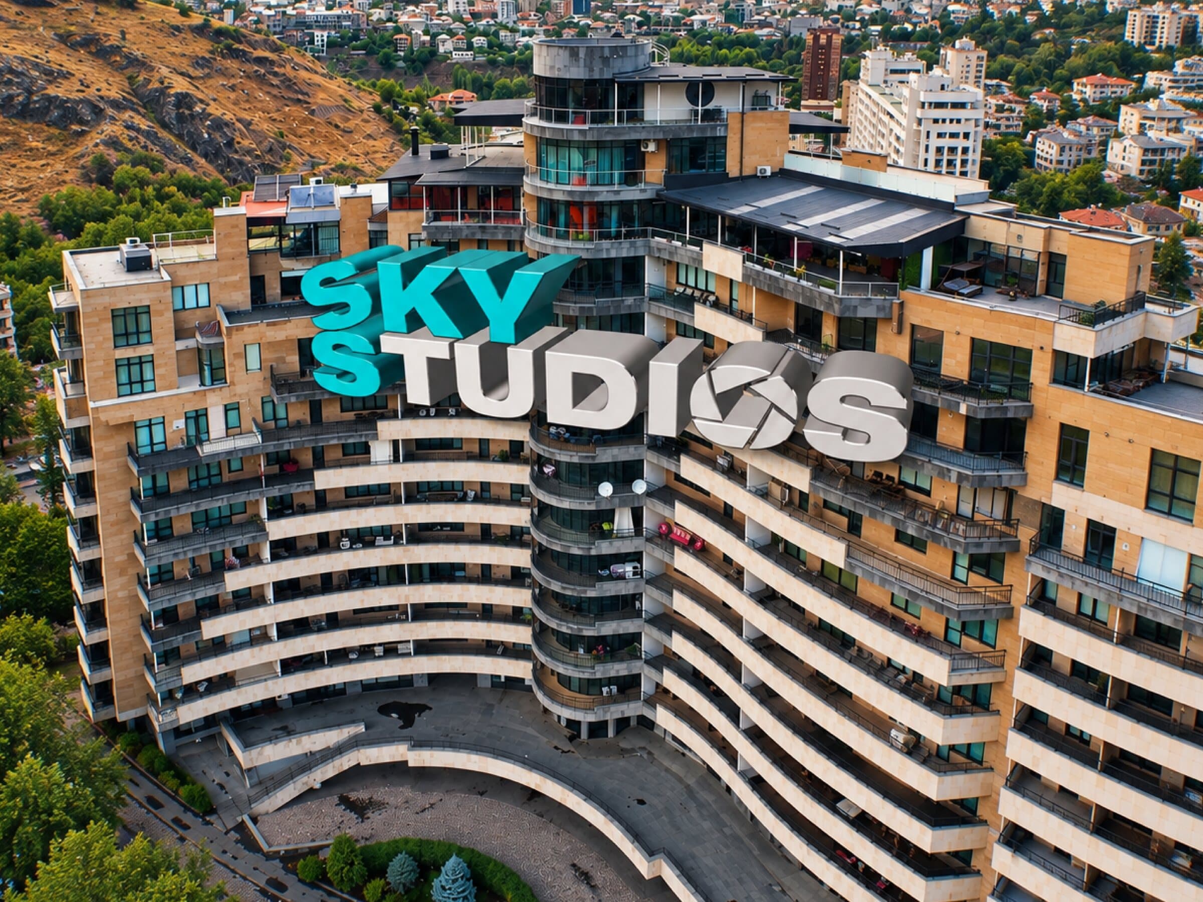The Sky Studios building with its rooftop sign above Yerevan